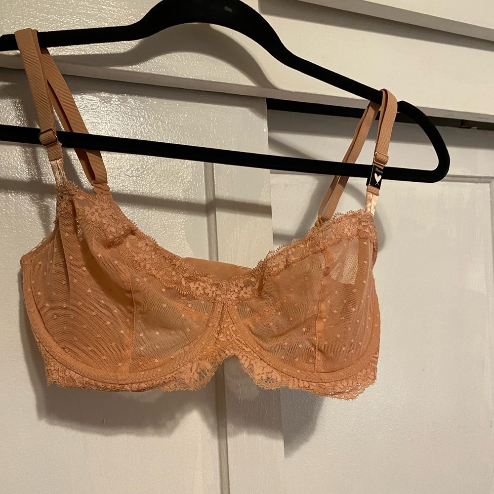 Brand new with tags peach lace Victoria Secret bra.